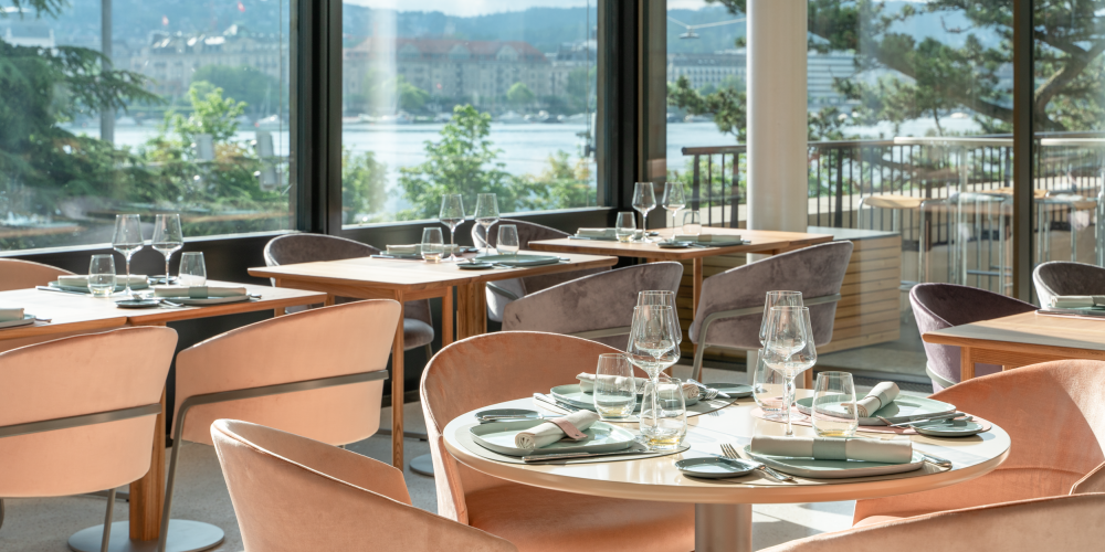 Elegantly furnished restaurant with an exclusive ambience and lake view.